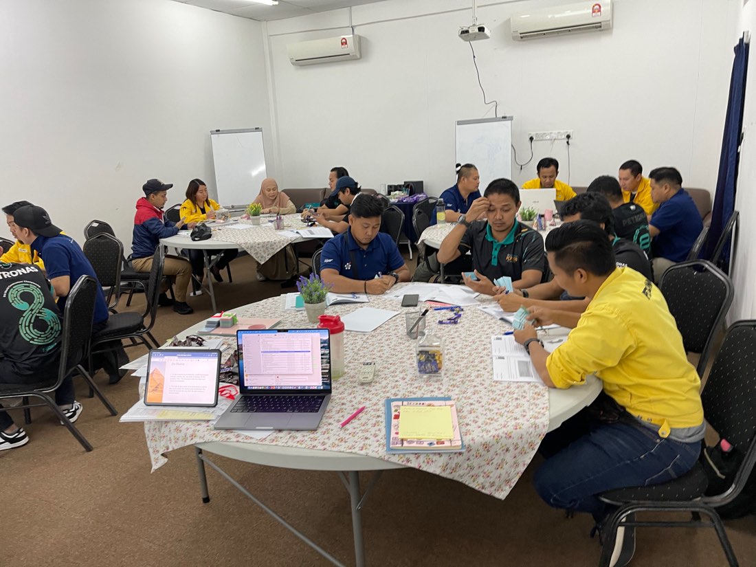 Participants working in groups at round tables