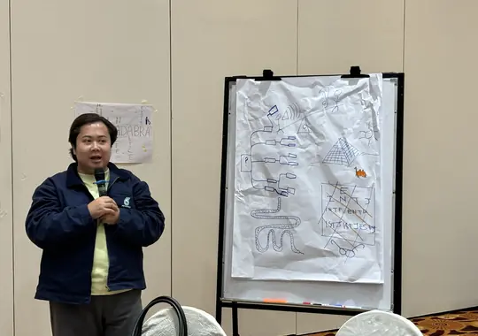 A participant presenting the team's flipchart