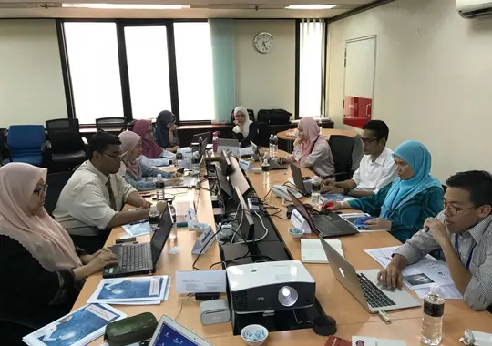 Participants at laptops during an analysis session