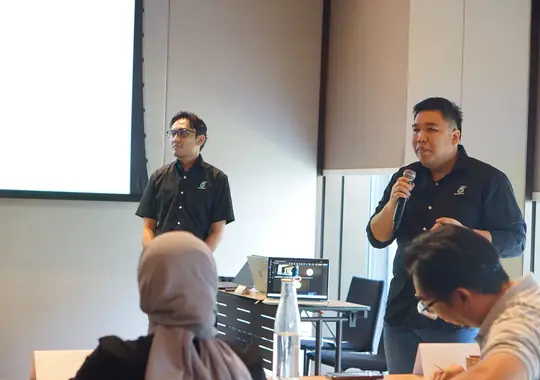 A presenter answering questions from the floor