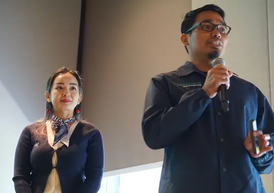 Two participants presenting their team's case
