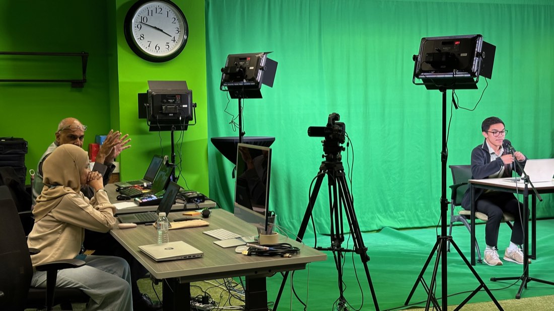 Participants recording presentations in a video studio