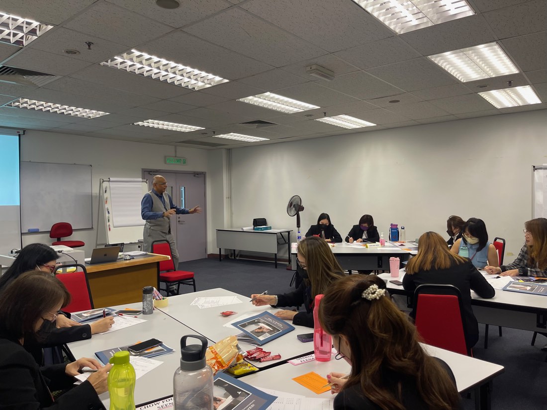 Participants writing during a workshop