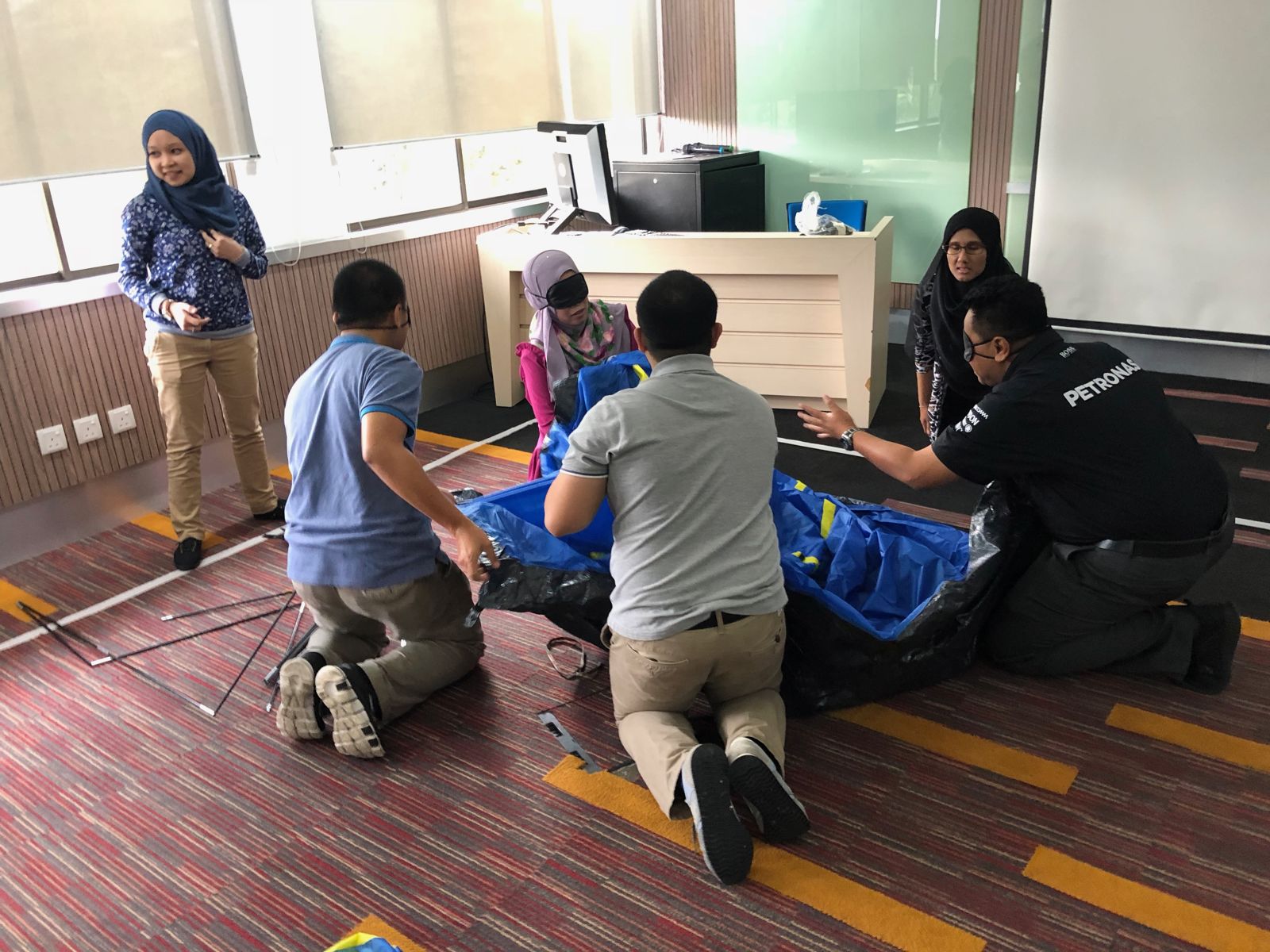 Participants working together on a team challenge